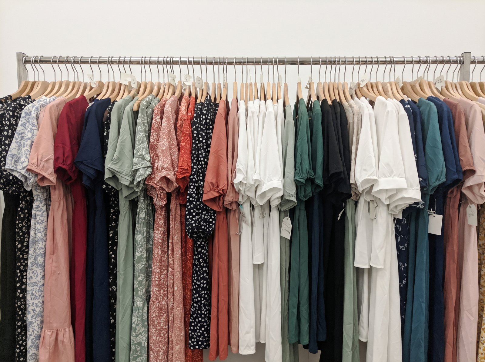 Women's dresses and blouses on a rack